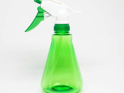 Close up of sports equipment and water bottle on a clean surface