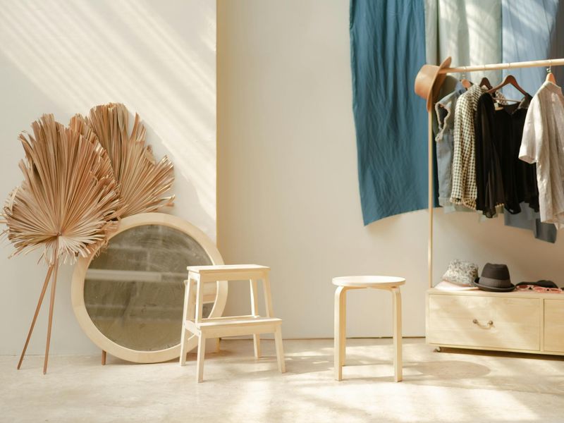 Minimalist bright studio space with natural wooden floor and soft morning light